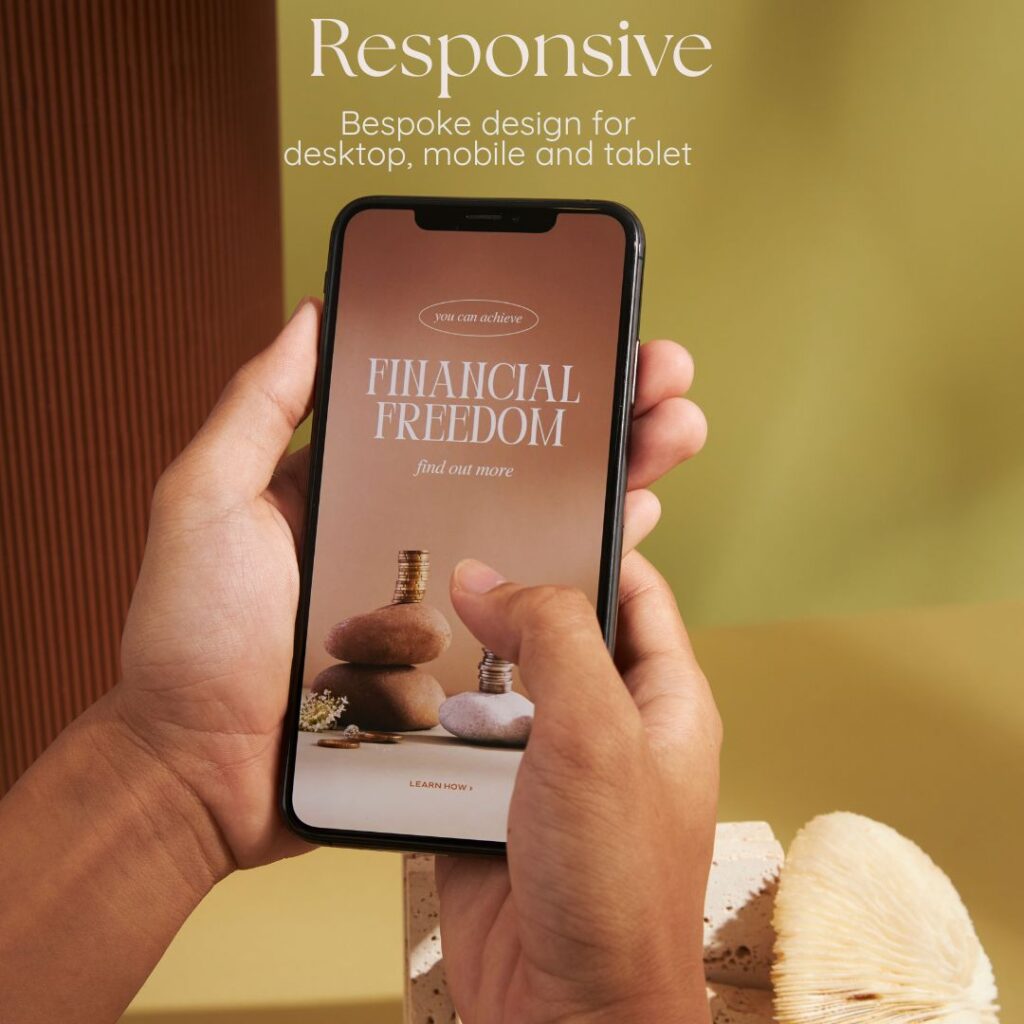 Image of website on mobile phone reading "Responsive, bespoke design for desktop, mobile and tablet"