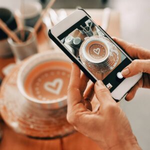 Image of taking a photo of pottery on an iphone