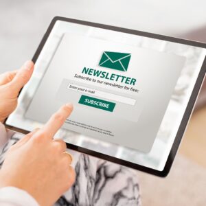 Image of a person clicking on a newsletter subscription sign up page